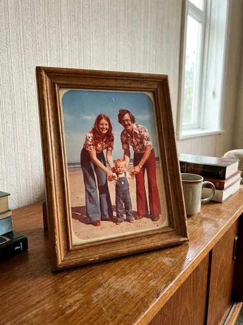 A framed print photographed on a sideboard
